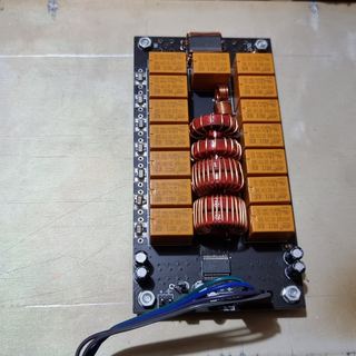 A board of relays laid out in an empty chassis