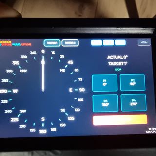 The hub touchscreen showing a compass dial, preset buttons and node link status