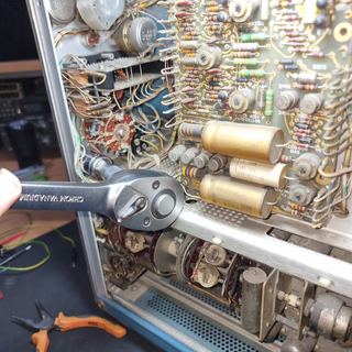 Taking the CAL OUT BNC connector out of the panel, first view