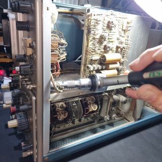 Taking the CAL OUT BNC connector out of the panel, second view